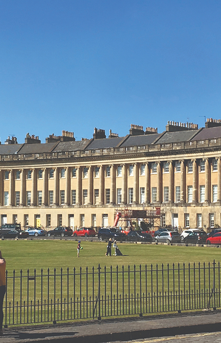 people standing in front of a large building with Royal Crescent in the background